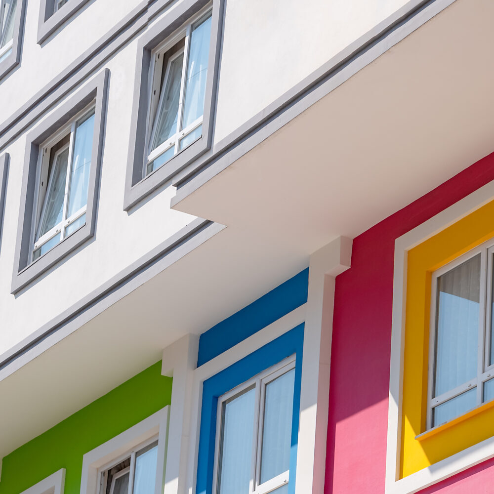 Fragment of the corner of a bright multi-colored building.